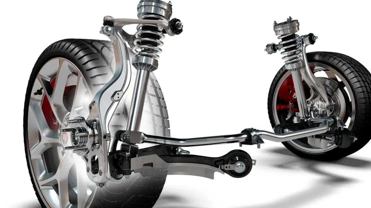 Wyświetla mechanizm zawieszenia w samochodzie z amortyzatorami, sprężynami i elementami układu kierowniczego.