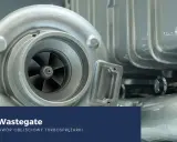 Turbosprężarka z widocznym wirnikiem i obudową. Tekst: "Zawór Wastegate. Jak działa zawór obejściowy turbosprężarki".