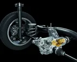 Przekładnia napędu 4x4 z widocznym mechanizmem i elementami zawieszenia.