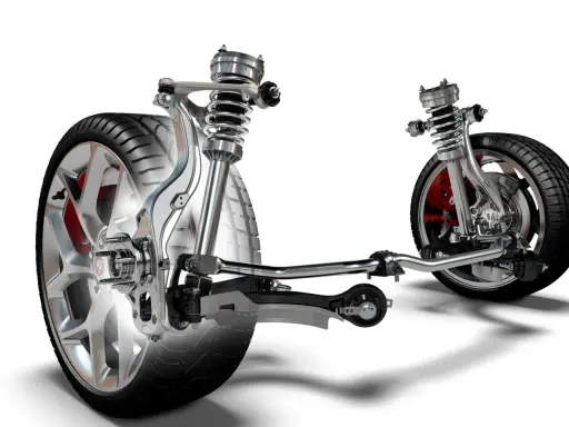 Wyświetla mechanizm zawieszenia w samochodzie z amortyzatorami, sprężynami i elementami układu kierowniczego.