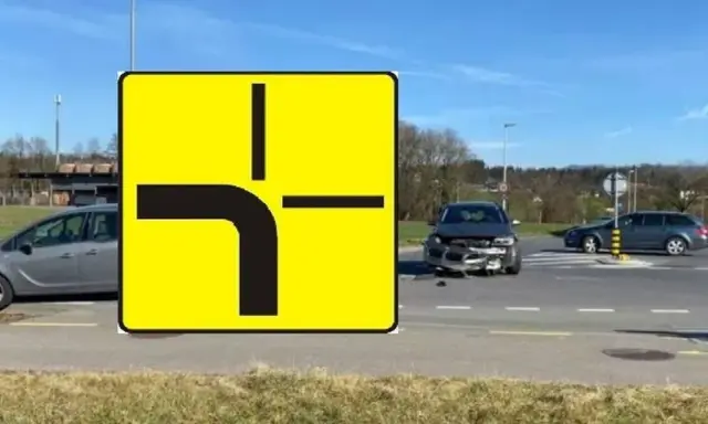 Znak drogi z pierwszeństwem przejazdu i uszkodzony samochód na skrzyżowaniu. Wypadek spowodowany łamanym pierwszeństwem.